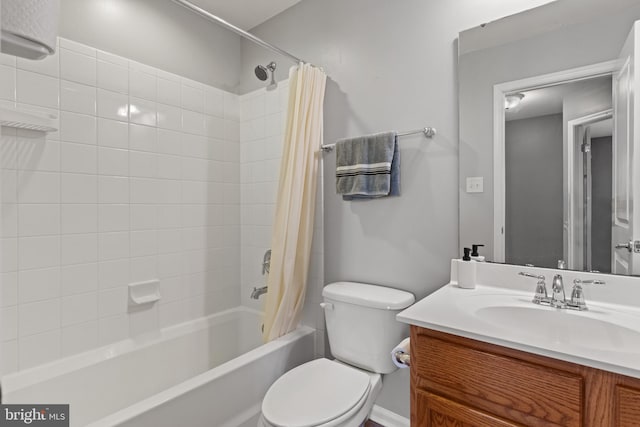 full bath featuring vanity, shower / bathtub combination with curtain, and toilet