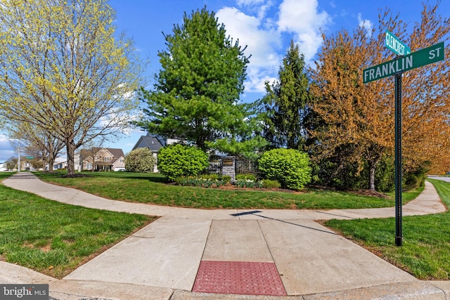 view of community featuring a yard