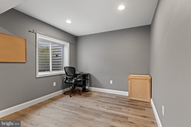 office area featuring baseboards, light wood finished floors, and recessed lighting