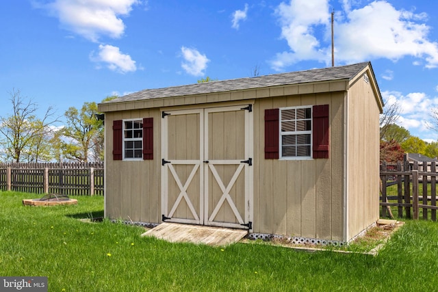 view of shed featuring a fenced backyard