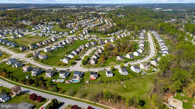 birds eye view of property with a residential view