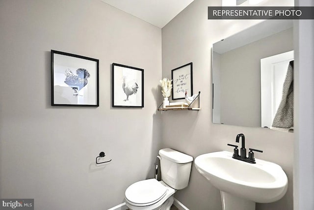 93 Long Bend Dr Lot 155, Carlisle, PA 17015 - half bath featuring a sink, toilet, and baseboards