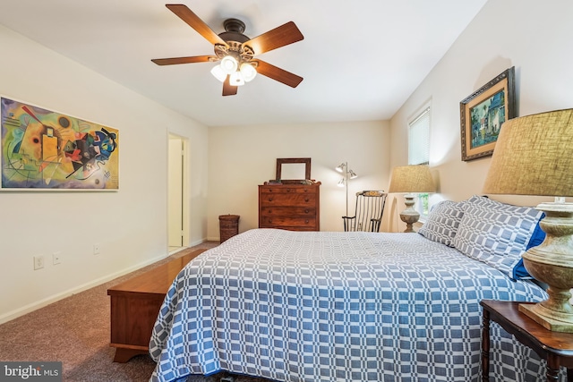 bedroom with ceiling fan, carpet flooring, and baseboards