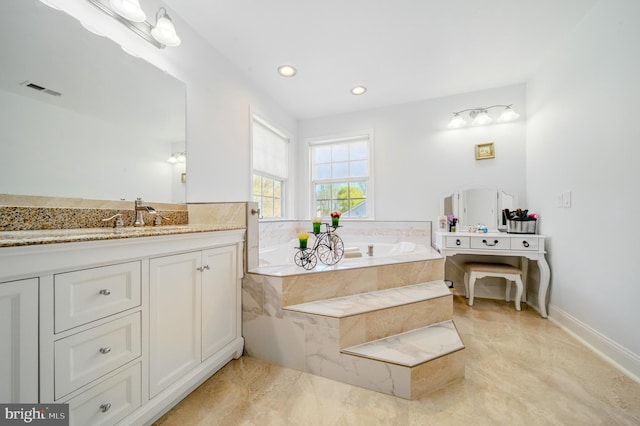 bathroom featuring vanity, baseboards, recessed lighting, visible vents, and a garden tub