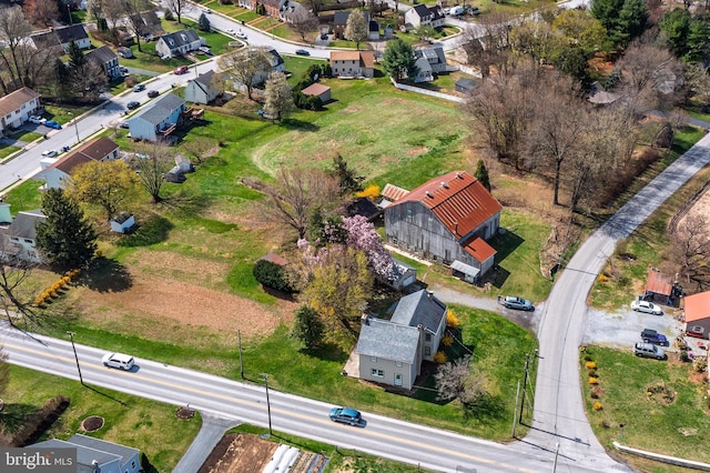 birds eye view of property with a residential view