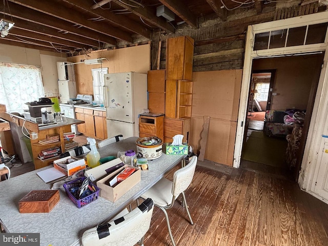 interior space with plenty of natural light and dark wood finished floors