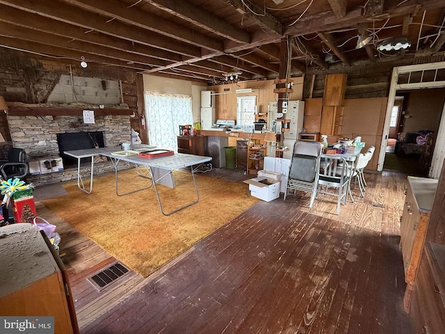 interior space with hardwood / wood-style floors and visible vents