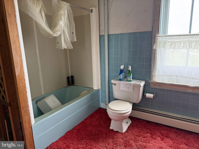 full bath with tile walls, toilet, shower / bathtub combination, and baseboard heating
