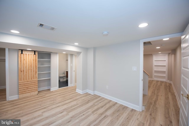 interior space with visible vents, light wood-type flooring, and recessed lighting