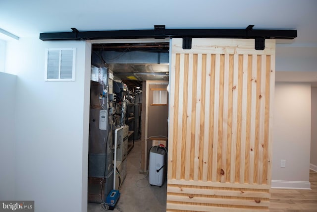 basement featuring baseboards and visible vents
