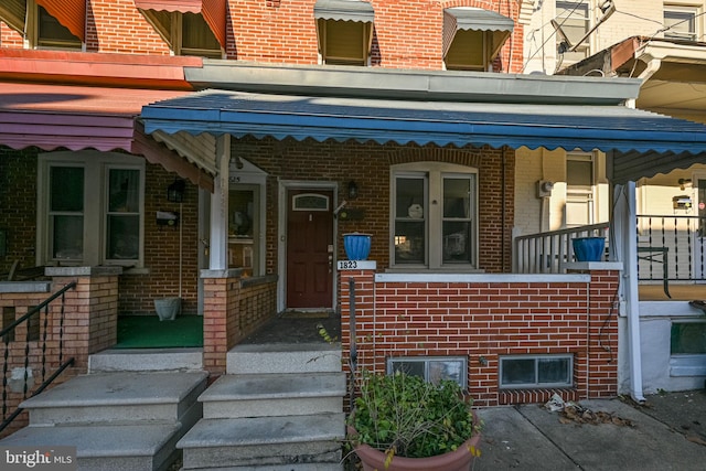 property entrance with brick siding