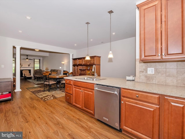6538 Autumn Olive Dr, Frederick, MD 21703 - kitchen with dishwasher, a sink, a peninsula, light wood-style floors, and backsplash
