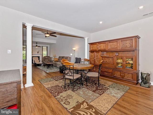 6538 Autumn Olive Dr, Frederick, MD 21703 - dining room featuring decorative columns, light wood-type flooring, a ceiling fan, visible vents, and recessed lighting