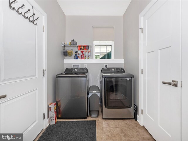 6538 Autumn Olive Dr, Frederick, MD 21703 - washroom featuring washer and clothes dryer, tile patterned flooring, and laundry area