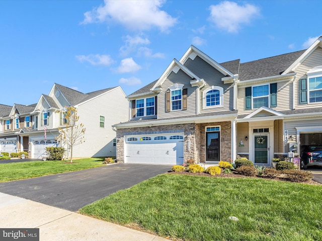 6538 Autumn Olive Dr, Frederick, MD 21703 - multi unit property featuring aphalt driveway, a front yard, stone siding, a garage, and a residential view
