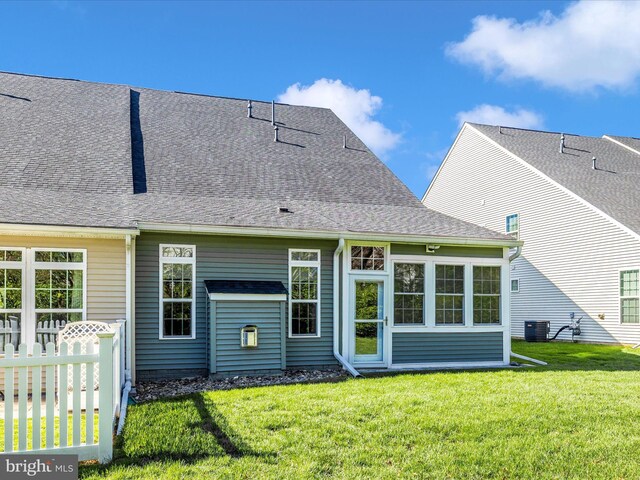 6538 Autumn Olive Dr, Frederick, MD 21703 - back of house with a yard, fence, and a shingled roof