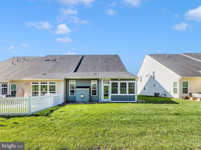 6538 Autumn Olive Dr, Frederick, MD 21703 - back of property with fence, cooling unit, a lawn, and roof with shingles
