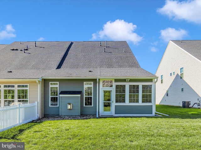 6538 Autumn Olive Dr, Frederick, MD 21703 - rear view of house featuring roof with shingles, central air condition unit, fence, and a lawn