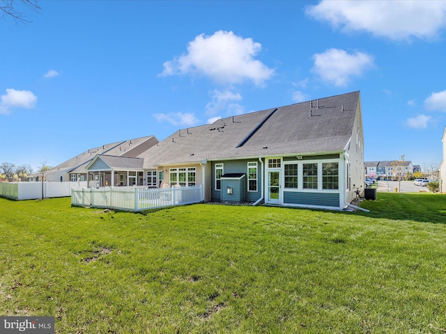6538 Autumn Olive Dr, Frederick, MD 21703 - back of property featuring a yard, fence, a sunroom, and roof with shingles