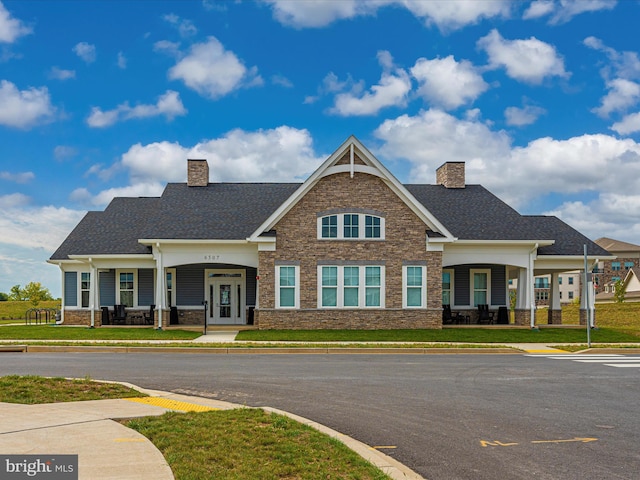 6538 Autumn Olive Dr, Frederick, MD 21703 - craftsman-style home featuring a front yard, stone siding, and a chimney