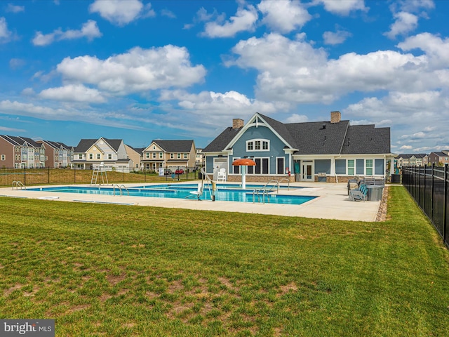 6538 Autumn Olive Dr, Frederick, MD 21703 - pool featuring a patio area, a residential view, fence, and a lawn