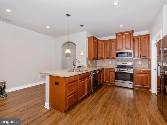 6538 Autumn Olive Dr, Frederick, MD 21703 - kitchen with a peninsula, visible vents, appliances with stainless steel finishes, light countertops, and a sink