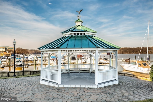 view of property's community featuring a water view and a gazebo