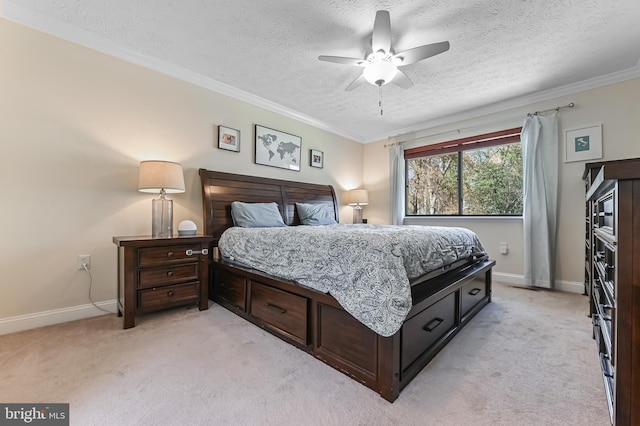 bedroom with a textured ceiling, light colored carpet, and crown molding