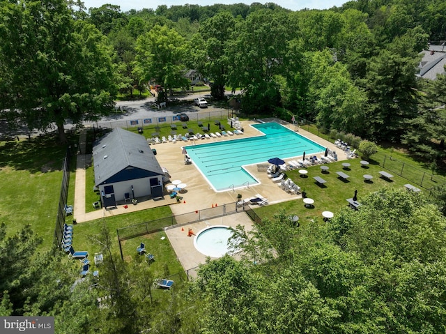 birds eye view of property with a view of trees
