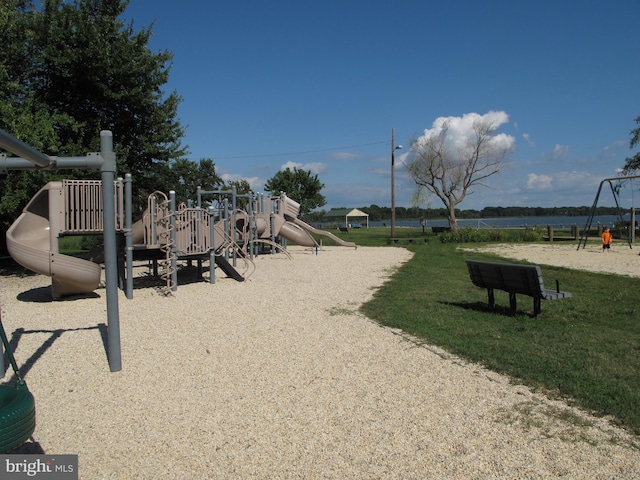 surrounding community with a yard and playground community