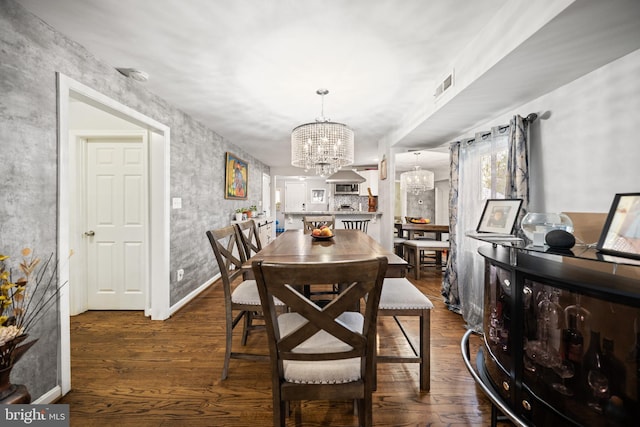 1107 Elfin Ave, Capitol Heights, MD 20743 - dining room featuring baseboards, visible vents, dark wood-style floors, and a notable chandelier