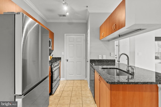 kitchen with stainless steel appliances, a sink, visible vents, brown cabinets, and ornamental molding