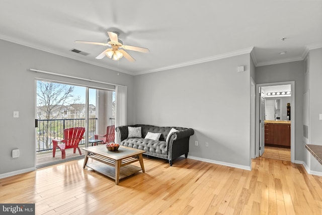 living area featuring baseboards, visible vents, light wood-style floors, ceiling fan, and ornamental molding