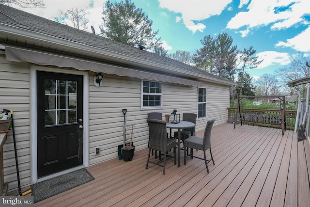 deck with outdoor dining area