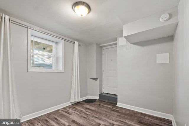 18 Rhode Island Ave NE, Washington, DC 20002 - unfurnished room with dark wood-style flooring and baseboards