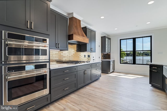 14671 Banks Odee Rd, Newburg, MD 20664 - kitchen featuring custom exhaust hood, appliances with stainless steel finishes, tasteful backsplash, and crown molding