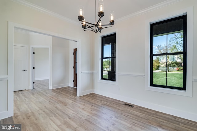 14671 Banks Odee Rd, Newburg, MD 20664 - spare room featuring wood finished floors, an inviting chandelier, baseboards, ornamental molding, and visible vents