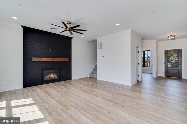 14671 Banks Odee Rd, Newburg, MD 20664 - unfurnished living room featuring stairway, light wood-type flooring, a large fireplace, and ceiling fan