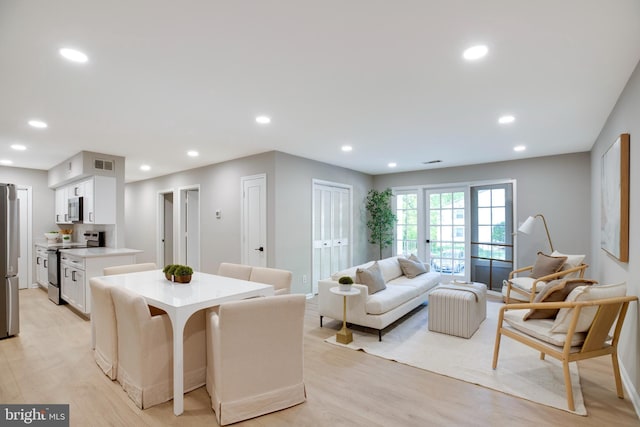 5901 Kingsford Rd Unit 440, Springfield, VA 22152 - living area with visible vents, recessed lighting, light wood finished floors, and baseboards
