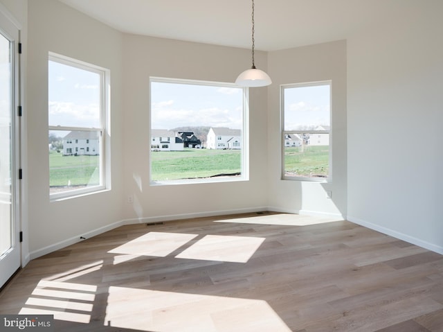 75 Cori Dr, Gilbertsville, PA 19525 - unfurnished dining area featuring a wealth of natural light, visible vents, baseboards, and wood finished floors
