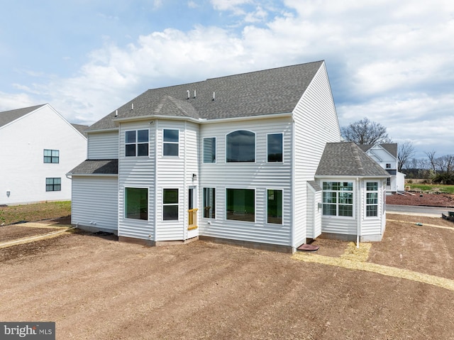 75 Cori Dr, Gilbertsville, PA 19525 - rear view of house with driveway and a shingled roof