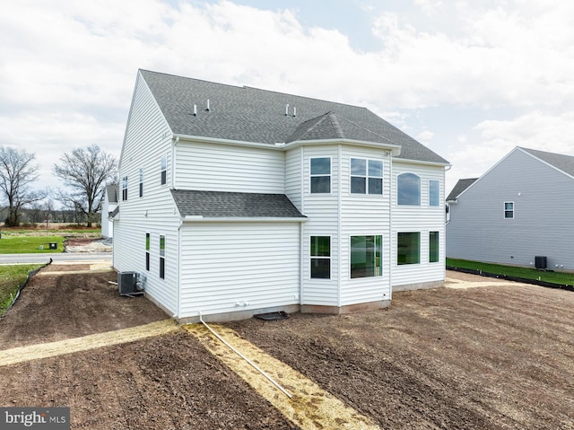 75 Cori Dr, Gilbertsville, PA 19525 - back of house with roof with shingles and central AC unit