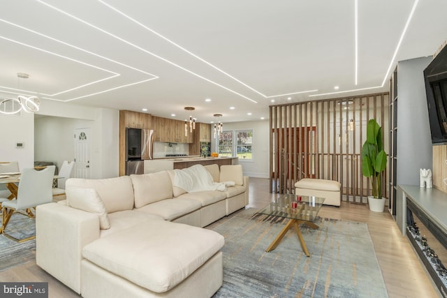 1242 Clearfield Cir, Lutherville Timonium, MD 21093 - living area with light wood-style flooring, recessed lighting, and a chandelier