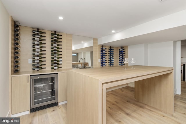 1242 Clearfield Cir, Lutherville Timonium, MD 21093 - wine area featuring light wood-type flooring, wine cooler, bar, and recessed lighting