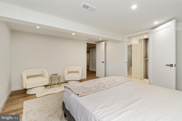 1242 Clearfield Cir, Lutherville Timonium, MD 21093 - bedroom featuring baseboards, visible vents, recessed lighting, wood finished floors, and a walk in closet