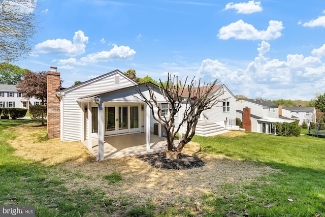 1242 Clearfield Cir, Lutherville Timonium, MD 21093 - rear view of house with a chimney, central air condition unit, a patio area, french doors, and a lawn