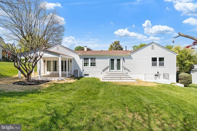 1242 Clearfield Cir, Lutherville Timonium, MD 21093 - back of property featuring a patio area, a lawn, a chimney, and french doors