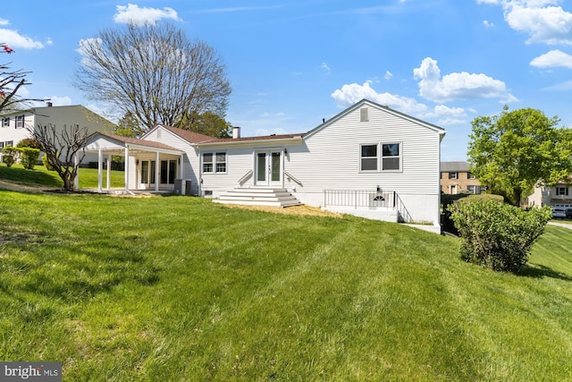 1242 Clearfield Cir, Lutherville Timonium, MD 21093 - back of property with central AC unit, a yard, and french doors