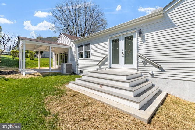 1242 Clearfield Cir, Lutherville Timonium, MD 21093 - back of house featuring a yard, cooling unit, and french doors