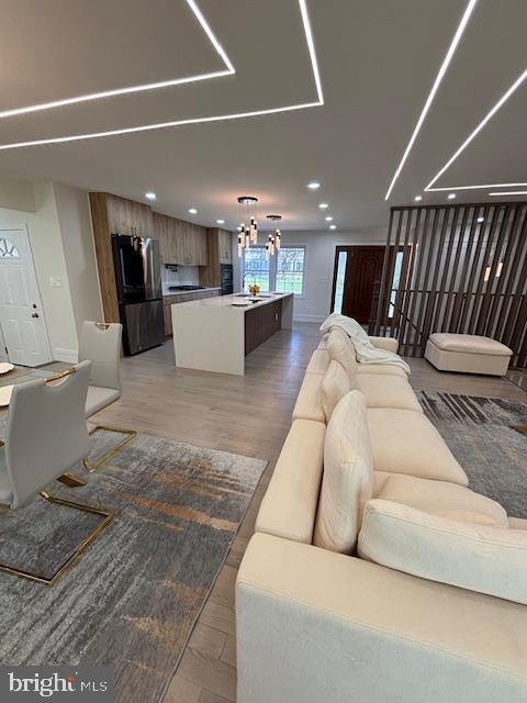 1242 Clearfield Cir, Lutherville Timonium, MD 21093 - living area with recessed lighting, baseboards, and a notable chandelier